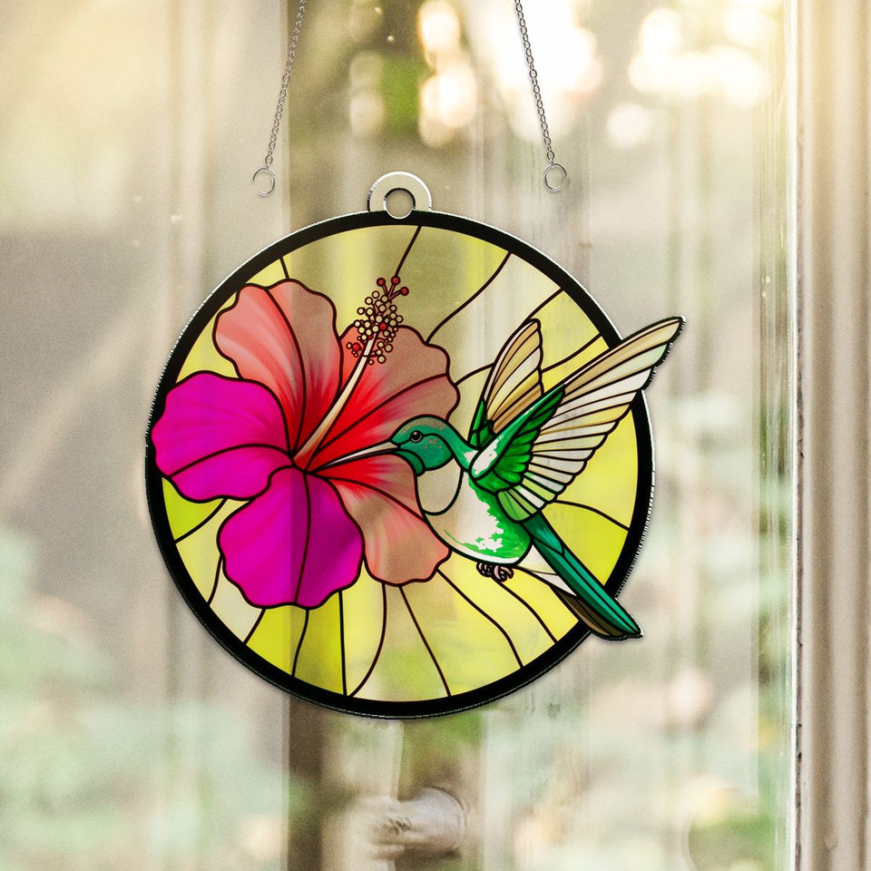 Hummingbird Hibiscus Circle Acrylic Suncatcher hanging in a sunny window