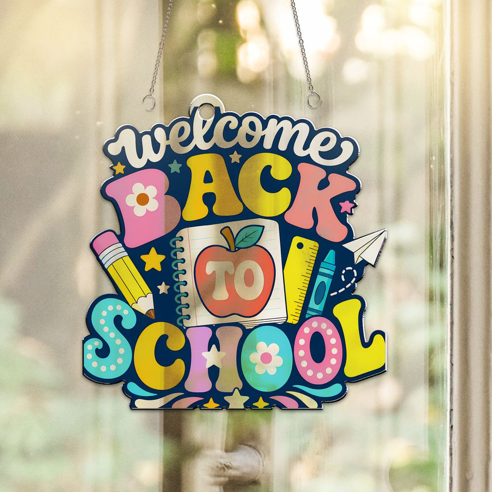 Welcome Back to School Notebook Acrylic Suncatcher hanging in a sunny window